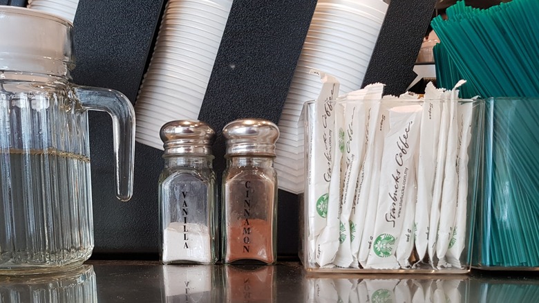 Close-up of items on a Starbucks self-service counter