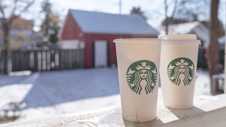 Starbucks cups outside in the snow