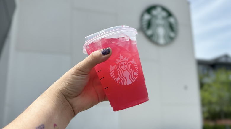 hand holding Starbucks pink lemonade