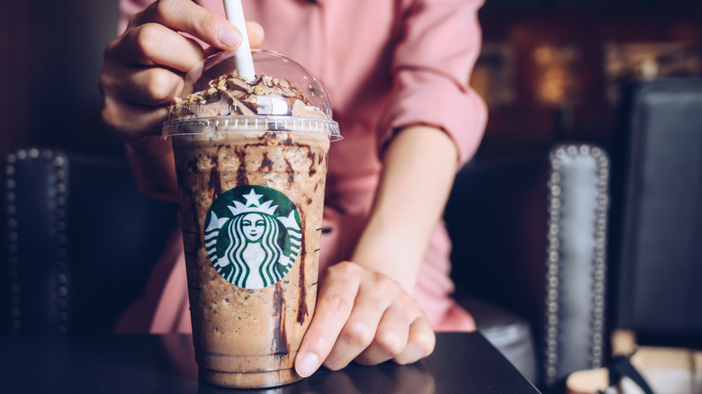 Hands holding a Starbucks Frappuccino