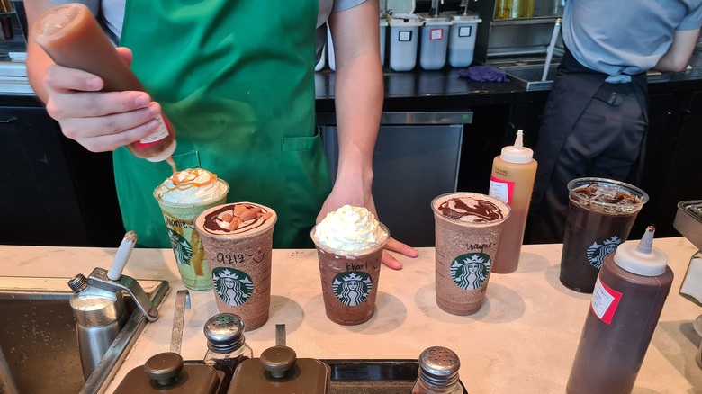 Starbucks employees making beverages