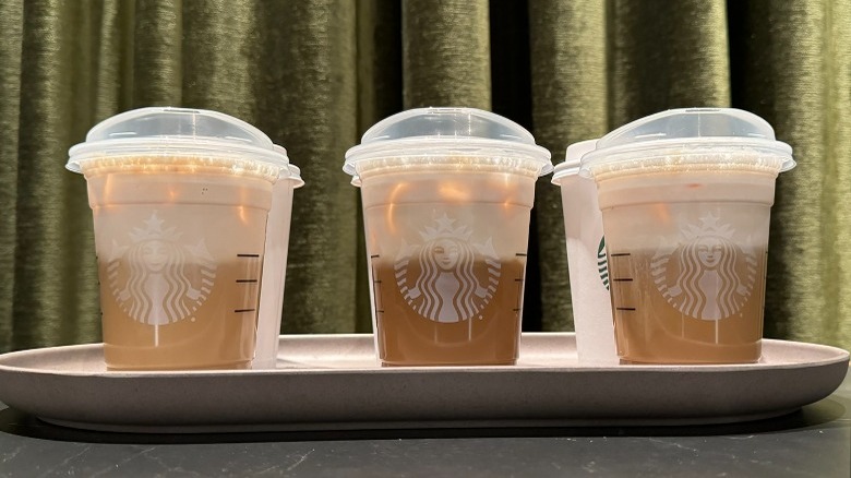 Three Starbucks drinks iced in front of three hot