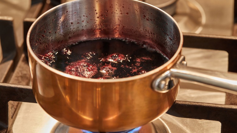 dark liquid simmering in pot