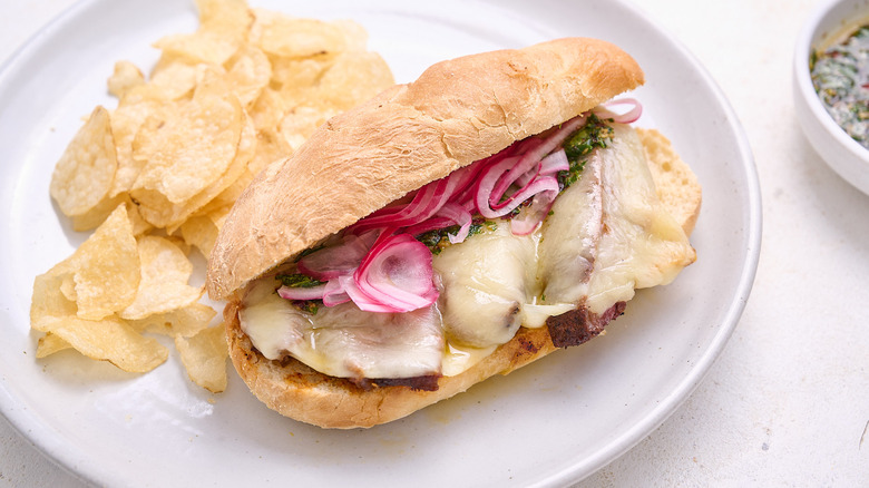 steak and chimichurri sandwich on plate