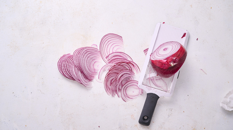 slicing onions on table