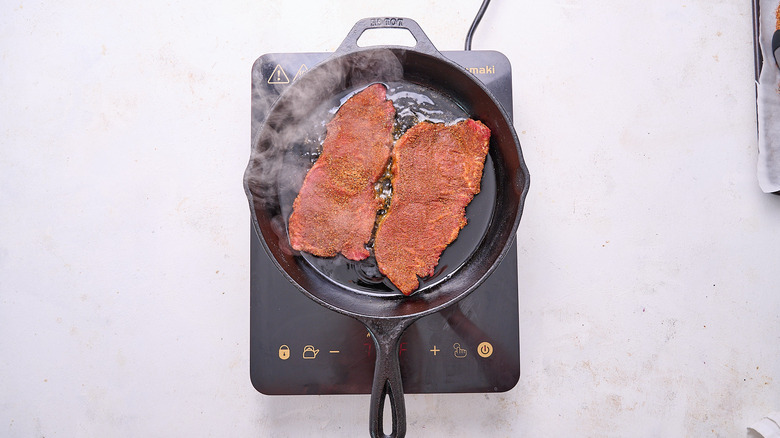 searing steaks in skillet