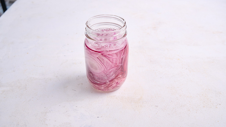 onions and vinegar in jar