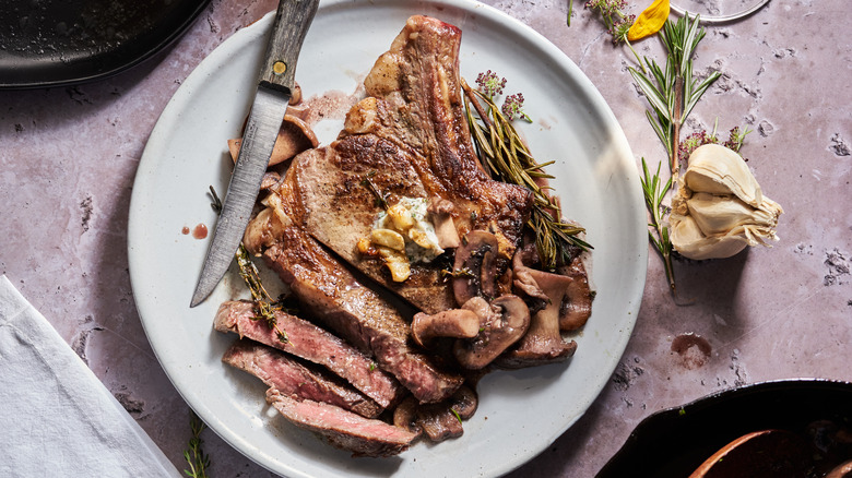 steak and mushrooms on plate