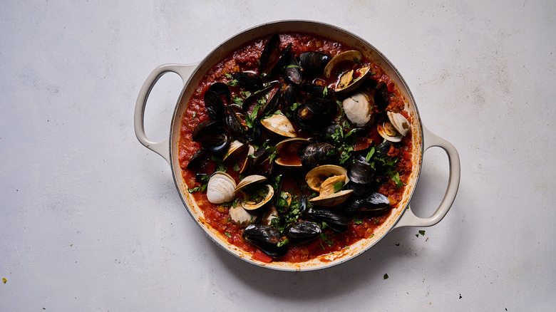 cooked mussels and clams shellfish in chorizo broth