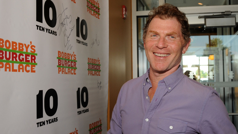 Bobby Flay smiling at anniversary event