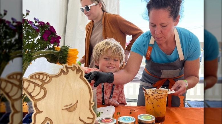 Stephanie Izard scooping her chili crunch