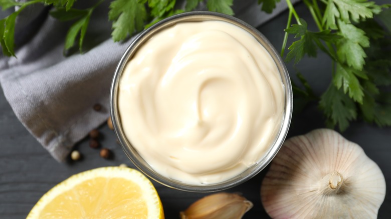 Bowl of mayonnaise with garlic and lemon