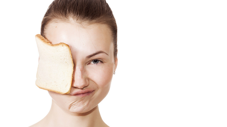 bread on woman's face