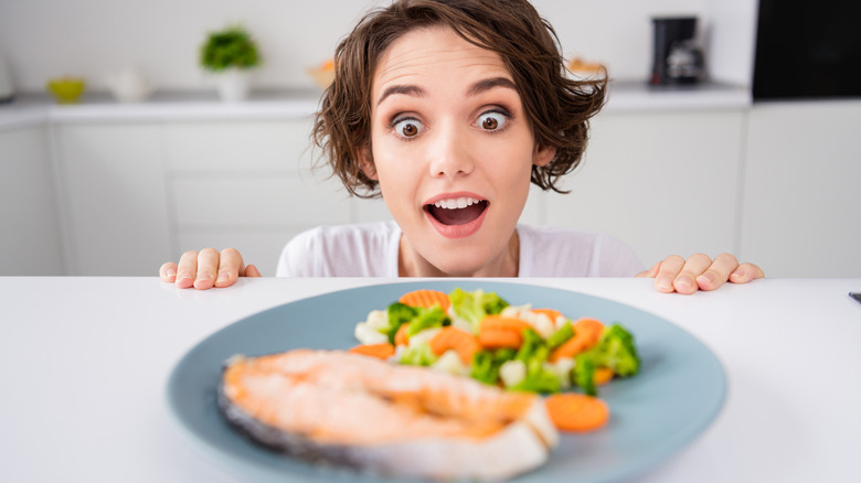 woman amazed by salmon dinner