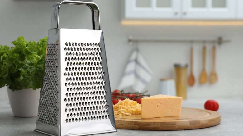 grater and block of cheese