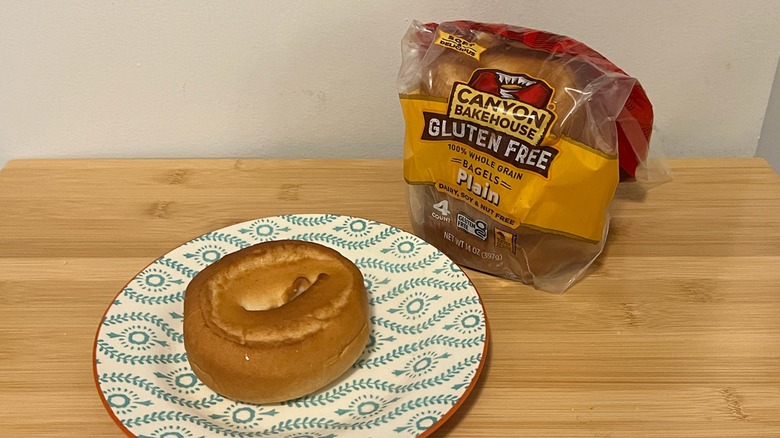 Canyon Bakehouse plain bagel on a plate with the package