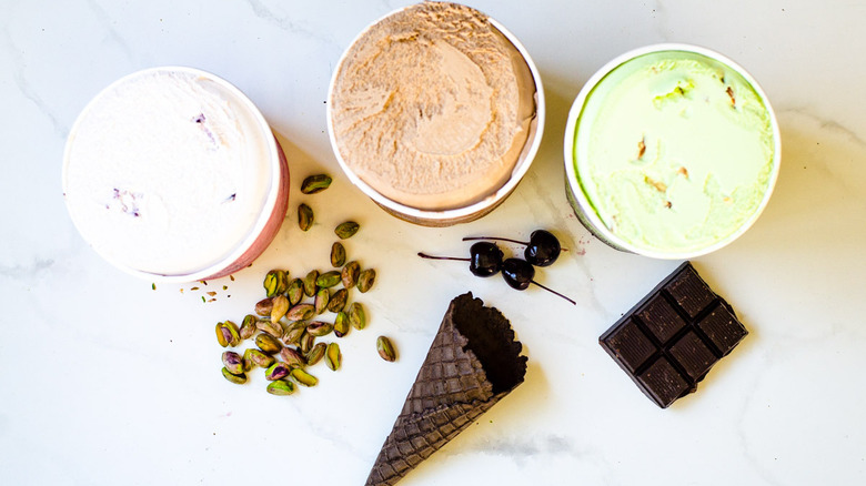 Tubs of ice cream with ingredients