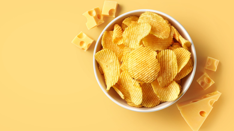 Bowl of ridged potato chips and cheese