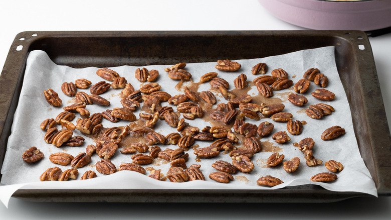 candied pecans cooling on paper