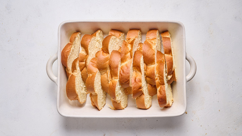 slices of bread in casserole dish