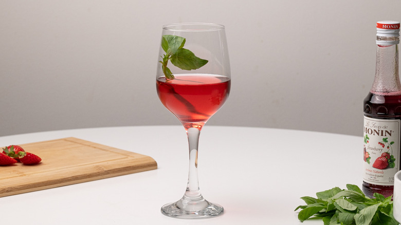 Basil in strawberry wine spritzer