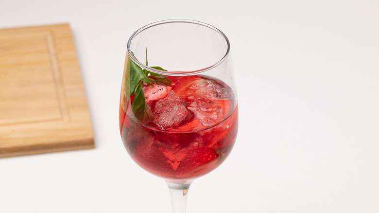 preparing strawberry basil spritzer