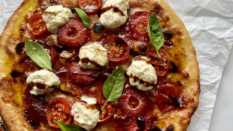 close up strawberry tomato pizza