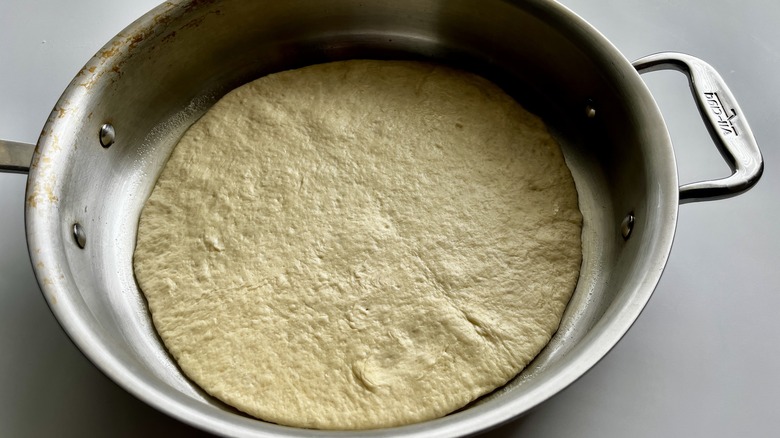 round dough in skillet