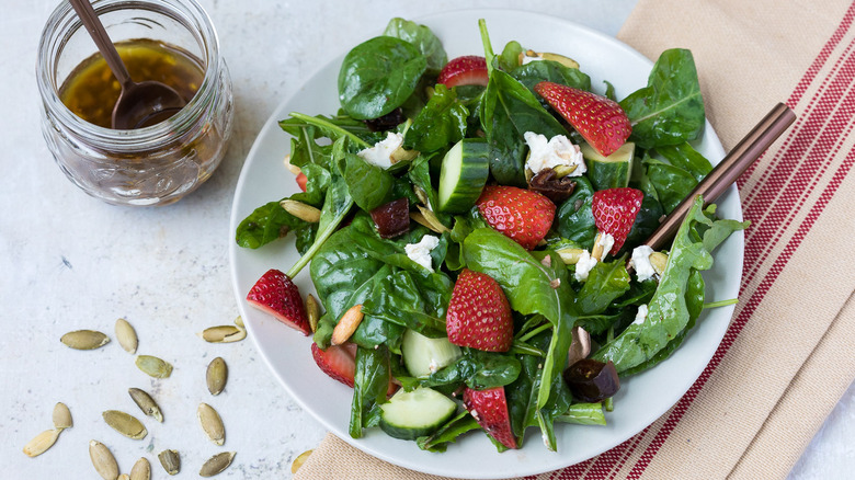 strawberry arugula salad in bowl