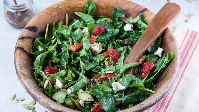 strawberry arugula salad in bowl