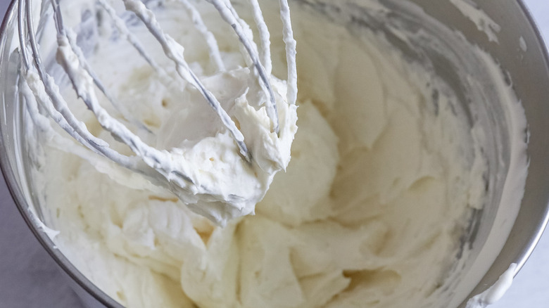 frosting in bowl/on whisk