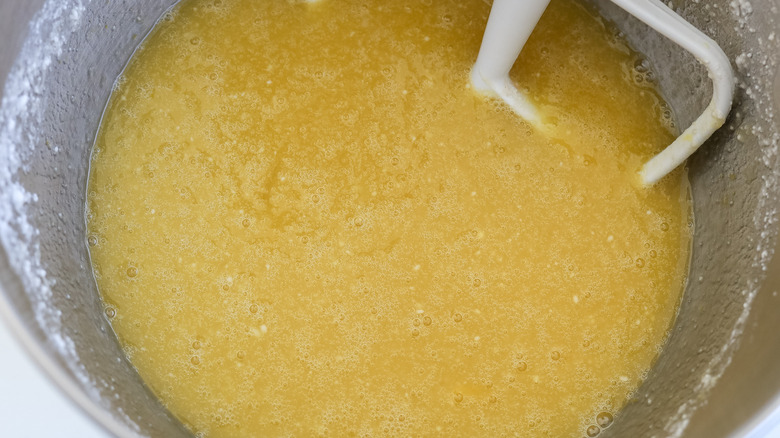 Wet cake ingredients beaten in a stand mixer bowl