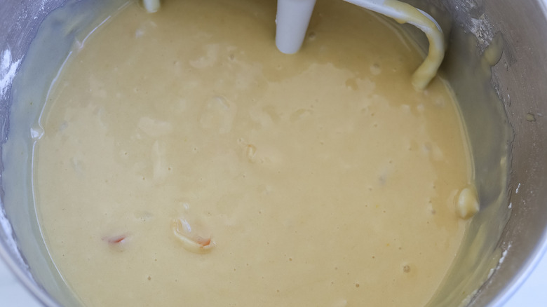 Lychee cake batter in the bowl of a stand mixer