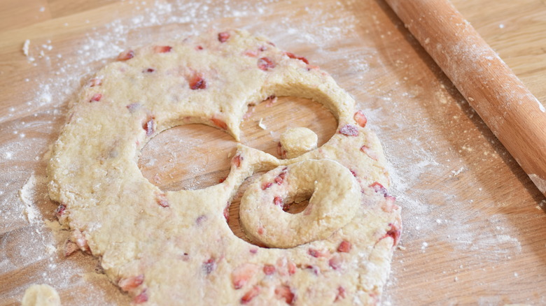 cutting donuts from dough