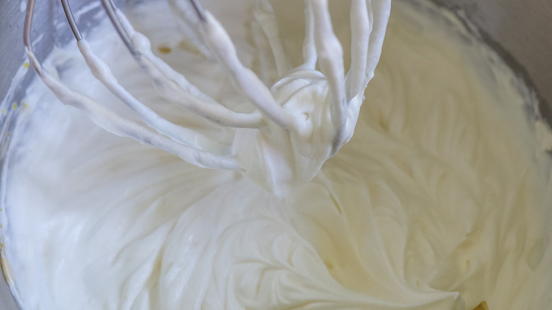 white frosting in mixing bowl