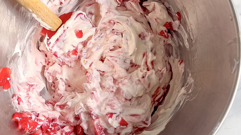 strawberry frosting in mixing bowl