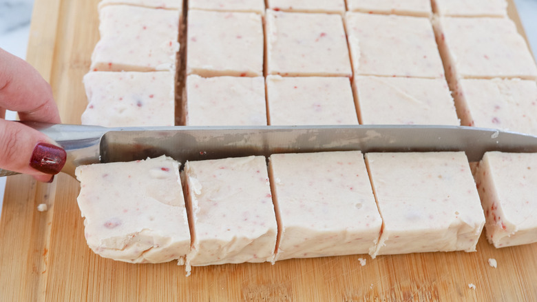 hand cutting fudge in squares