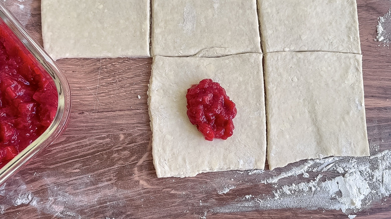 strawberry rhubarb filling placed on turnover dough