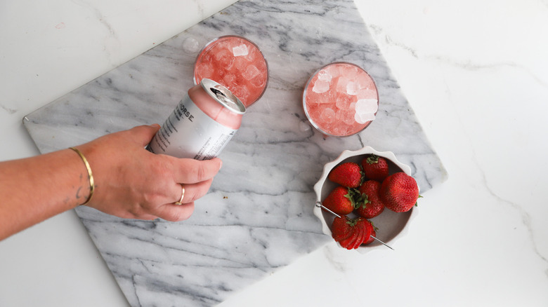 Pouring wine into glasses