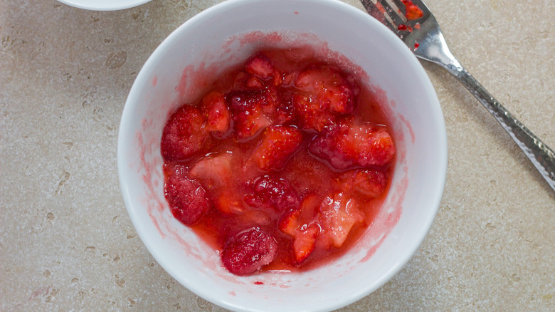 mashed strawberries in a bowl