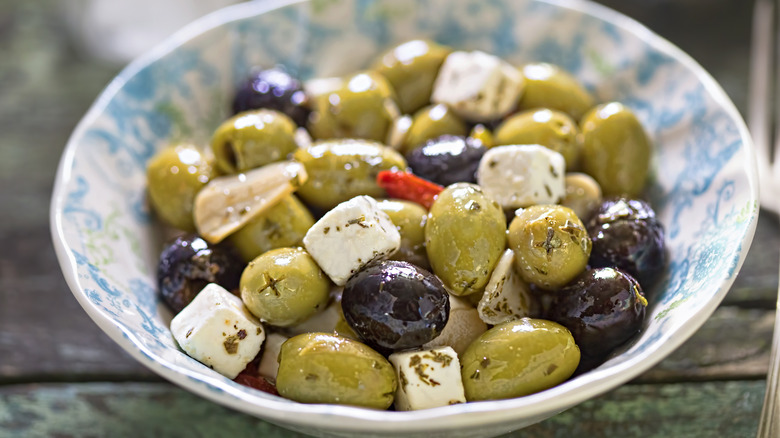 Bowl of cheese and olives