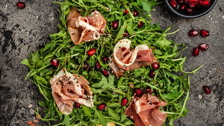 prosciutto and arugula on board