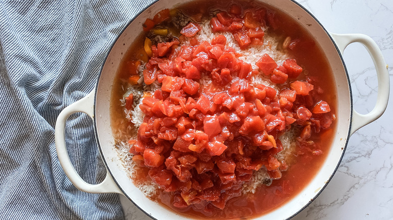 tomatoes, rice, beans, beef in skillet
