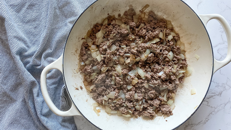 beef and onion in pan