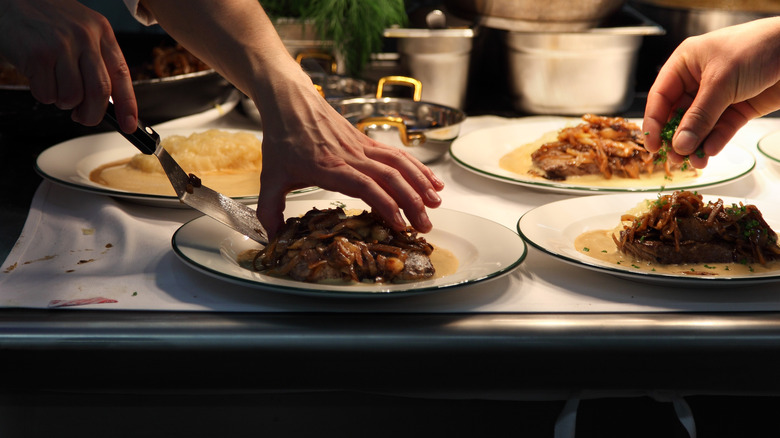 food being plated on table