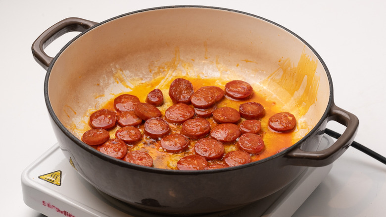 frying slices of chorizo