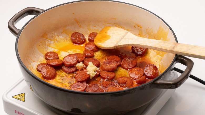 frying chorizo with garlic