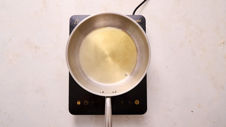 heating oil in a skillet