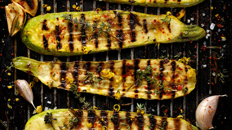 grilled zucchini halves on barbecue