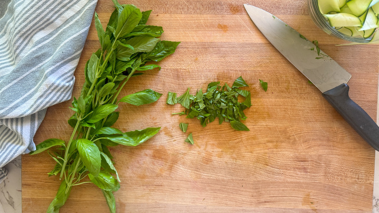 sliced basil on board